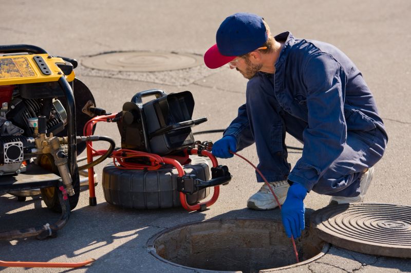Technician Inspecting Sewer Line